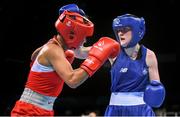 22 June 2015; Ceire Smith, Ireland, right, exchanges punches with Saiana Sagataeva, Russia, during their Women's Boxing Fly 51kg Quarter Final bout. 2015 European Games, Crystal Hall, Baku, Azerbaijan. Picture credit: Stephen McCarthy / SPORTSFILE