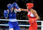 22 June 2015; Ceire Smith, Ireland, left, exchanges punches with Saiana Sagataeva, Russia, during their Women's Boxing Fly 51kg Quarter Final bout. 2015 European Games, Crystal Hall, Baku, Azerbaijan. Picture credit: Stephen McCarthy / SPORTSFILE