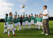 2 September 2008; Republic of Ireland Soccer Star Kevin Doyle met with the Shelbourne FC's U-11 team who will represent Ireland in this year's Danone Nations Cup World Finals in Paris from the 5th-7th of September. Doyle is 'Godfather' to this year's team, who will take part in the prestigious tournament involving 40 countries from around the World. Kevin with Captain Aaron Ashe, from Ormond Quay, as his team-mates look on. AUL, Clonshaugh, Dublin. Picture credit: Brian Lawless / SPORTSFILE