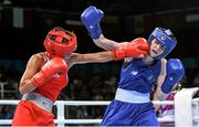 22 June 2015; Ceire Smith, Ireland, right, exchanges punches with Saiana Sagataeva, Russia, during their Women's Boxing Fly 51kg Quarter Final bout. 2015 European Games, Crystal Hall, Baku, Azerbaijan. Picture credit: Stephen McCarthy / SPORTSFILE