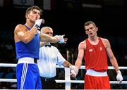 23 June 2015; Josh Kelly, Great Britain, is announced victorious over Adam Nolan, Ireland, by referee Vladyslav Malyshev, following their Men's Boxing Welter 69kg Quarter Final bout. 2015 European Games, Crystal Hall, Baku, Azerbaijan. Picture credit: Stephen McCarthy / SPORTSFILE
