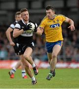 20 June 2015; Cian Breheny, Sligo, in action against Ian McBride, Roscommon. Connacht GAA Football Senior Championship, Semi-Final, Sligo v Roscommon, Markievicz Park, Sligo. Picture credit: Oliver McVeigh / SPORTSFILE