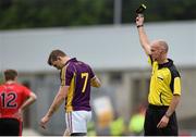27 June 2015; Adrian Flynn, Wexford, is black carded by referee Cormac Reilly. GAA Football All-Ireland Senior Championship, Round 1B, Wexford v Down. Innovate Wexford Park, Wexford. Picture credit: Matt Browne / SPORTSFILE