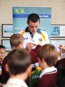 11 September 2008; Banking on success. Ulster Bank official and Kerry GAA star Kieran Donaghy during a visit to Holy Family National School, Tralee. Pupils were given a real treat as former pupil Donaghy, along with team-mate Darren O'Sullivan, took time out from their All-Ireland Final preparations to answer questions and sign autographs, with thanks to Ulster Bank, official sponsors of the GAA Football All-Ireland Championships. Holy Family National School, Tralee, Co. Kerry. Picture credit: Brendan Moran / SPORTSFILE