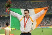 13 September 2008; Ireland's Jason Smyth, from Eglington, Co. Derry, celebrates on the podium after he won the Men's 100m T13 Final to win Gold and set a new world and paralympic record in a time of 10.62, beating his own world record of 10.81 which he set in this mornings heats. Beijing Paralympic Games 2008, Men's 100m T13 Final, National Stadium, Olympic Green, Beijing, China. Picture credit: Brian Lawless / SPORTSFILE