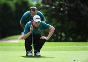 17 September 2008; Robert Dervin and his caddy John Doherty, Ballina Golf Club, line up a putt on the 6th green during the Bulmers Junior Cup Semi-Finals. Bulmers Cups and Shields Finals 2008, Monkstown Golf Club, Parkgarriff, Monkstown, Co. Cork. Picture credit: Ray McManus / SPORTSFILE