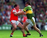 20 August 2000; Cathal O'Rourke of Armagh i stackled by Darragh Ó Sé of Kerry during the Bank of Ireland All-Ireland Senior Football Championship Semi-Final match between Kerry and Armagh at Croke Park in Dublin. Photo by Ray McManus/Sportsfile