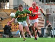 20 August 2000; Dara O Cinneide of Kerry in action against Gerard Reid of Armagh during the Bank of Ireland All-Ireland Senior Football Championship Semi-Final match between Kerry and Armagh at Croke Park in Dublin. Photo by John Mahon/Sportsfile
