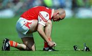 20 August 2000;  Gerard Reid of Armagh ties his boot laces during the Bank of Ireland All-Ireland Senior Football Championship Semi-Final match between Kerry and Armagh at Croke Park in Dublin. Photo by Damien Eagers/Sportsfile
