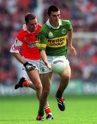 20 August 2000; Aodan MacGearailt of Kerry in action against Andrew McCann of Armagh during the Bank of Ireland All-Ireland Senior Football Championship Semi-Final match between Kerry and Armagh at Croke Park in Dublin. Photo by Ray McManus/Sportsfile