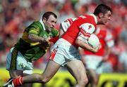 20 August 2000; Oisin McConville of Armagh in action against Seamus Moynihan of Kerry during the Bank of Ireland All-Ireland Senior Football Championship Semi-Final match between Kerry and Armagh at Croke Park in Dublin. Photo by Damien Eagers/Sportsfile