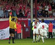 24 August 2000; Darren O'Keeffe of Bohemians is shown a red card by referee Leif Sundell during the UEFA Cup Qualifying Round Second Leg match between Bohemians and Aberdeen at Tolka Park in Dublin. Photo by David Maher/Sportsfile