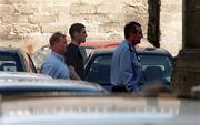 29 August 2000; Republic of Ireland players Mark Kennedy is accompanied by team security officer Tony Hickey and a member of An Garda Siochana as he arrives at Dublin Dictrict Court after being arrested in Dublin the previous night. He and team-mate Phil Babb were subsequently dropped from the Republic of Ireland squad for the FIFA World Cup Qualifier in the Netherlands. Photo by Ray Lohan/Sportsfile