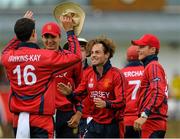 11 July 2015; Jersey bowler Corne Bodenstein, centre, celebrates with team-mate Anthony Kay, left, after they caught and bowled Irfan Ahmed, Hong Kong, for 17 runs. ICC World Twenty20 Qualifier 2015, Hong Kong v Jersey, Bready, Co. Tyrone. Picture credit: Brendan Moran / ICC / SPORTSFILE