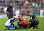 11 July 2015; Clare manager Davy Fitzgerald, Clare medical staff and referee Barry Kelly check on the well being of Brendan Bugler, Clare. GAA Hurling All-Ireland Senior Championship, Round 2, Clare v Cork. Semple Stadium, Thurles, Co. Tipperary. Picture credit: Stephen McCarthy / SPORTSFILE