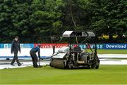 13 July 2015; Groundstaff cover the crease after rain delayed play. ICC World Twenty20 Qualifier 2015, Namibia v USA, Stormont, Belfast, Co. Antrim. Picture credit: David Maher / ICC / SPORTSFILE