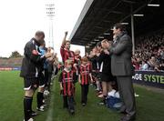 12 October 2008; Kevin Hunt and his daughter Sienna wave to the crowd before the game. Kevin Hunt Testimonial Match, Bohemians XI v International XI, Dalymount Park, Dublin. Picture credit: John Barrington / SPORTSFILE