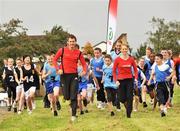 13 October 2008; Irish Olympians Derval O'Rourke and David Gillick, with children from Deansrath Community College, Clondalkin, Co.Dublin, at the launch of the Athletics Ireland Mile Challenge for Schools supported by SPAR. Deansrath Community College, Clondalkin, Co. Dublin. Picture credit: David Maher / SPORTSFILE