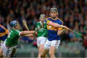 16 July 2015; John McGrath, Tipperary, in action against Michael Casey, Limerick. Bord Gáis Energy Munster GAA U21 Hurling Championship, Semi-Final, Limerick v Tipperary. Gaelic Grounds, Limerick. Picture credit: Dáire Brennan / SPORTSFILE