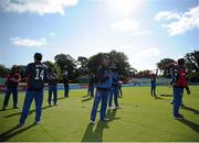 18 July 2015; Nepal players perform stretches during the warm up. ICC World Twenty20 Qualifier 2015, Nepal v Jersey. Malahide, Dublin. Picture credit: Sam Barnes / ICC / SPORTSFILE