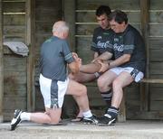 26 October 2008; Irish manager Sean Boylan assisted by Dr Eoin Clarke applies aquapressure to Bryan Collen's foot during Ireland International Rules squad training. 2008 International Rules tour, Stribling Reserve, Lorne, Victoria, Auatralia. Picture credit: Ray McManus / SPORTSFILE