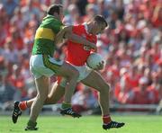 2 September 2000; Paddy McKeever of Armagh is tackled by Seamus Moynihan of Kerry during the Bank of Ireland All-Ireland Senior Football Championship Semi-Final Replay match between Kerry and Armagh at Croke Park in Dublin. Photo by Brendan Moran/Sportsfile