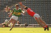 2 September 2000; Dara O'Cinneide, of kerry is blocked down by Kieran McGeeney of Armagh during the Bank of Ireland All-Ireland Senior Football Championship Semi-Final Replay match between Kerry and Armagh at Croke Park in Dublin. Photo by Brendan Moran/Sportsfile