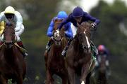 9 September 2000; Giant's Causeway, right, with Mick Kinane up on their way to win the Esat Digifone Irish Champion Stakes, from Greek Dance with Johnny Murtagh, left and Best of the Best, Frankie Dettori, centre during horse racing from Leopardstown in Dublin. Photo by Matt Browne/Sportsfile