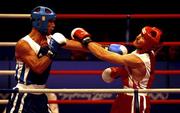 18 September 2000; Turkey's Firat Karagollu, left, lands a left to the jaw of Ireland's Michael Roche during his victory over Roche in the Men's 71kg First Round. Sydney Exhibition Hall 3, Darling Harbour, Sydney, Australia. Photo by Brendan Moran/Sportsfile