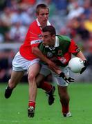 24 September 2000: Ronan Walsh of Mayo in action against Kieran McMahon of Cork during the All Ireland Minor Football Championship Final match between Cork and Mayo at Croke Park in Dublin. Photo by Ray McManus/Sportsfile