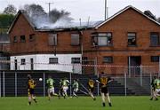 8 November 2008; A league game against Pomeroy goes ahead despite the remains of St Malachy’s GAA club premises Edendork, Tyrone, smouldering in the background. The club house was destroyed by fire in the early hours of Saturday morning. Picture credit: Michael Cullen / SPORTSFILE