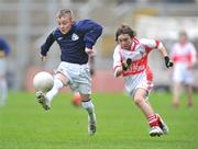 16 December 2008; Ian Greene, St. Bernadette's, in action against Dallan O'Gallchoir, Scoil Chrónáin. St. Bernadette's, Quarryvale v Scoil Chrónáin, Rathcoole, Corn an Chéid Final, Allianz Cumann na mBunscoil football finals, Croke Park, Dublin. Picture credit: David Maher / SPORTSFILE