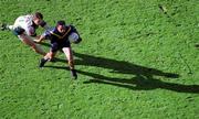 8 October 2000; Adam Yze of Australia in action against Paul McGrane of Ireland during the International Rules Series First Test match between Ireland and Australia at Croke Park in Dublin. Photo by Ray McManus/Sportsfile