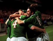 11 October 2000; Richard Dunne of Ireland (4) celebrates after scoring his side's second goal with team-mates including Robbie Keane, right, during the World Cup 2002 Qualifying group 2 match between Republic of Ireland and Estonia at Lansdowne Road in Dublin. Photo by David Maher/Sportsfile