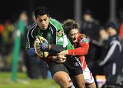 9 January 2009; Niva Ta'auso, Connacht, is tackled by Darren Daniel, Llanelli Scarlets. Magners League, Connacht v Llanelli Scarlets, Sportsground, Galway. Picture credit: Matt Browne / SPORTSFILE