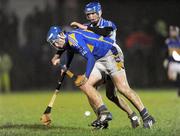 14 January 2009; John Devane, Tipperary, in action against Mark O'Brien, Waterford. Waterford Crystal Cup Quarter-Final, Waterford v Tipperary, St Molleran's Club, Carrick-On-Suir, Co. Tipperary. Picture credit: Matt Browne / SPORTSFILE