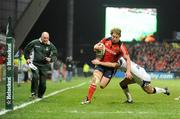 16 January 2009; Jerry Flannery, Munster, evades the tackle of Charlie Hodgson, Sale Sharks, on his way to scoring his side's second try. Heineken Cup, Pool 1, Round 5, Munster v Sale Sharks, Thomond Park, Limerick. Picture credit: Brendan Moran / SPORTSFILE