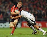 16 January 2009; Paul O'Connell, Munster, is tackled by Neil Briggs, Sale Sharks. Heineken Cup, Pool 1, Round 5, Munster v Sale Sharks, Thomond Park, Limerick. Picture credit: Brendan Moran / SPORTSFILE