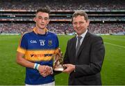 16 August 2015; Pictured is Jim Dollard, Executive Director for Business Service Centre and Electric Ireland, proud sponsor of the GAA All-Ireland Minor Championships, presenting Thomas Nolan, Tipperary, with the Player of the Match award for his outstanding performance in the Electric Ireland GAA Minor Hurling Championship Semi-Final, Tipperary vs Dublin, in Croke Park. Throughout the Championship fans can follow the action, support the Minors and be a part of something major through the hashtag #ThisIsMajor. Croke Park, Dublin. Picture credit: Stephen McCarthy / SPORTSFILE