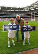 16 August 2015; Liberty Insurance flagbearers Jay Courtney, age 9, and his sister Jess Courtney, age 7, both members of Kilmacud Crokes GAA club in Dublin, with Dublin Hurling manager Ger Cunningham at the All Ireland Senior Hurling Semi-final between Galway & Tipperary. Croke Park, Dublin. Picture credit: David Maher / SPORTSFILE