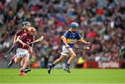 16 August 2015; Tom Mathews, Scoil Bhríde, Dunleer, Louth, representing Tipperary, in action against Michael Morgan, Scoil Ursula, Sligo, representing Galway, during the Cumann na mBunscol INTO Respect Exhibition Go Games 2015 at Tipperary v Galway - GAA Hurling All-Ireland Senior Championship Semi-Final. Croke Park, Dublin. Picture credit: Ray McManus / SPORTSFILE