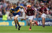 16 August 2015; Aidan Connor, Ballybrown NS, Clarina, Limerick, representing Tipperary, in action against Michael Morgan, Scoil Ursula, Sligo, representing Galway, during the Cumann na mBunscol INTO Respect Exhibition Go Games 2015 at Tipperary v Galway - GAA Hurling All-Ireland Senior Championship Semi-Final. Croke Park, Dublin. Picture credit: Stephen McCarthy / SPORTSFILE