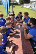 18 August 2015; Leinster rugby players Jamie Hagan and Tom Denton visited the Bank of Ireland Summer Camp in Clontarf FC for a Q&A session, autograph signings, and a few games on the pitch. Clontarf FC, Castle Avenue, Dublin. Picture credit: Sam Barnes / SPORTSFILE