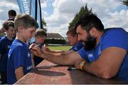 18 August 2015; Leinster rugby players Jamie Hagan and Tom Denton visited the Bank of Ireland Summer Camp in Clontarf FC for a Q&A session, autograph signings, and a few games on the pitch. Clontarf FC, Castle Avenue, Dublin. Picture credit: Sam Barnes / SPORTSFILE