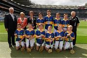 16 August 2015; Uachtarán Chumann Lúthchleas Gael Aogán Ó Fearghail, President of the INTO Emma Dineen, President of Cumann na mBunscoil Maireád O'Callaghan, with the Tipperary team, back row, left to right, Mikey Bergin, Golden NS, Cashel, Tipperary, Adam Donnelly, Mount Talbot NS, Roscommon, Aidan Connor, Ballybrown NS, Clarina, Limerick, Dara McGonigle, St. Canice’s PS, Dungiven, Derry, front row, left to right, James Corcoran, St. Colmcille’s, Templemore, Tipperary, Tom Matthews, Scoil Bhríde, Dunleer, Louth, Niall Duggan, St. Brigid’s Maghera, Derry, x, Don Corrigan, St. Mary’s PS, Killesher, Enniskillen, Fermanagh, Liam Doyle, Gaile NS, Holycross, Tipperary, Thomas Hughes, Castleblayney BNS, Monaghan before the Cumann na mBunscol INTO Respect Exhibition Go Games 2015 at Tipperary v Galway - GAA Hurling All-Ireland Senior Championship Semi-Final. Croke Park, Dublin. Picture credit: Ray McManus / SPORTSFILE