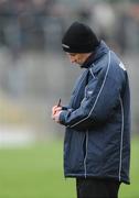 1 February 2009; New Donegal manager John Joe Doherty takes notes before the game. Allianz National Football League, Division 1, Round 1, Kerry v Donegal, Austin Stack Park, Tralee, Co. Kerry. Picture credit: Brendan Moran / SPORTSFILE