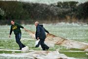 3 February 2009; Workers remove the covers off the course before the second round of the Hotel Minella Oaks  at the National Coursing Meeting. Powerstown Park, Clonmel, Co. Tipperary. Picture credit: David Maher / SPORTSFILE