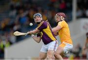 22 August 2015; Kevin Foley, Wexford, in action against Ryan McCambridge, Antrim. Bord Gáis Energy GAA Hurling All Ireland U21 Championship, Semi-Final, Wexford v Antrim. Semple Stadium, Thurles, Co. Tipperary. Picture credit: Dáire Brennan / SPORTSFILE