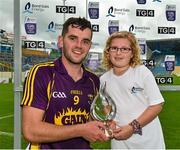22 August 2015; Tony French, Wexford, is presented with the Man of the match award by eight year old Kirsty Cheevers, from Ballymac, New Ross, after the game.  Bord Gáis Energy GAA Hurling All Ireland U21 Championship, Semi-Final, Wexford v Antrim. Semple Stadium, Thurles, Co. Tipperary. Picture credit: Ray McManus / SPORTSFILE