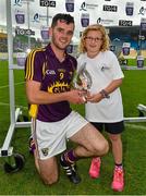 22 August 2015; Tony French, Wexford, is presented with the Man of the match award by eight year old Kirsty Cheevers, from Ballymac, New Ross, after the game.  Bord Gáis Energy GAA Hurling All Ireland U21 Championship, Semi-Final, Wexford v Antrim. Semple Stadium, Thurles, Co. Tipperary. Picture credit: Ray McManus / SPORTSFILE